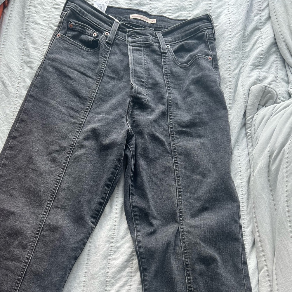 Black wash Levi’s high rise ankle jeans with front detailing
